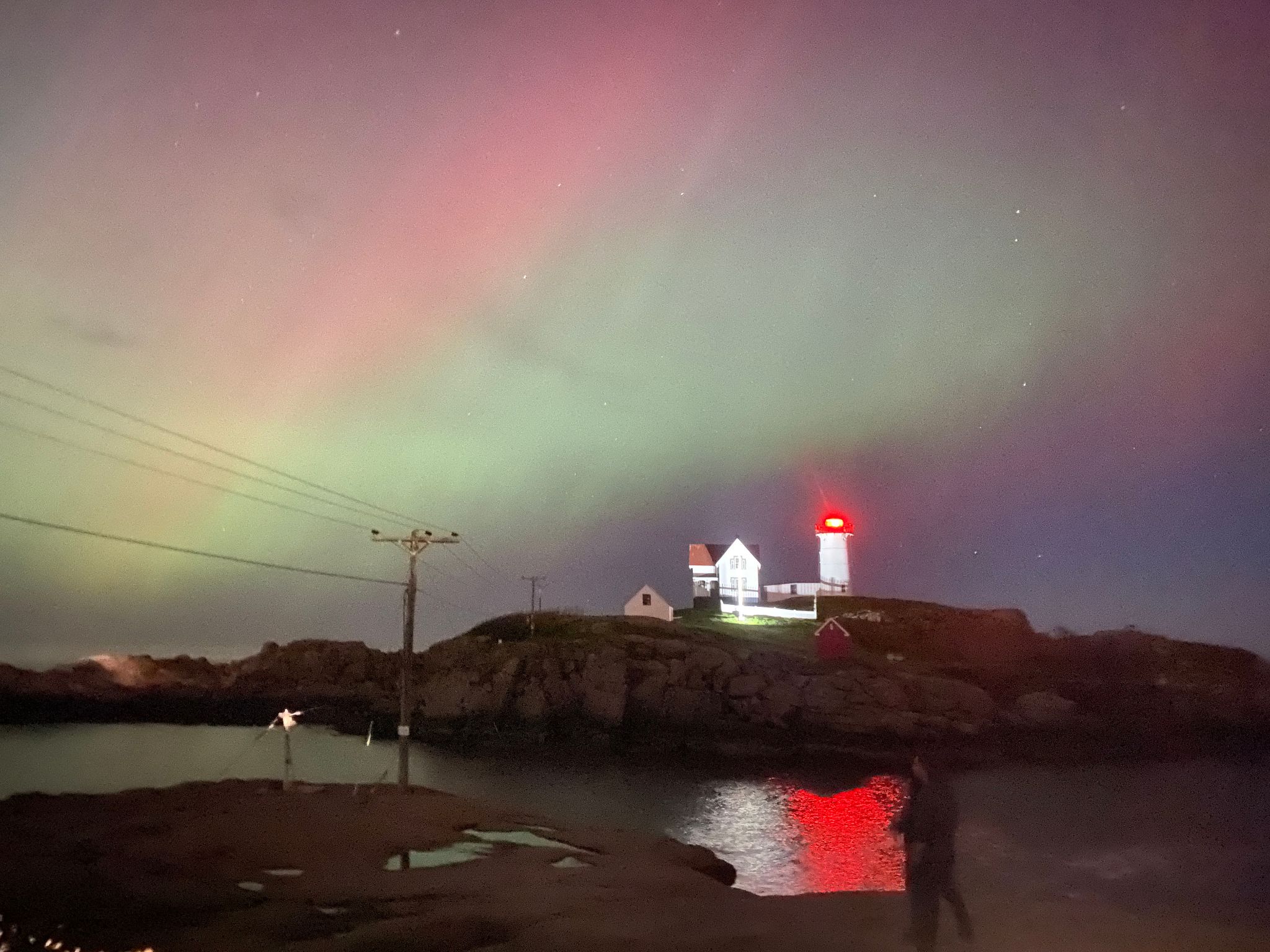 Community photo entitled Solar Storm Colors at Nubble Lighthouse by Patricia Evans on 05/05/2024 at Nubble Lighthouse, Cape Neddick, Maine