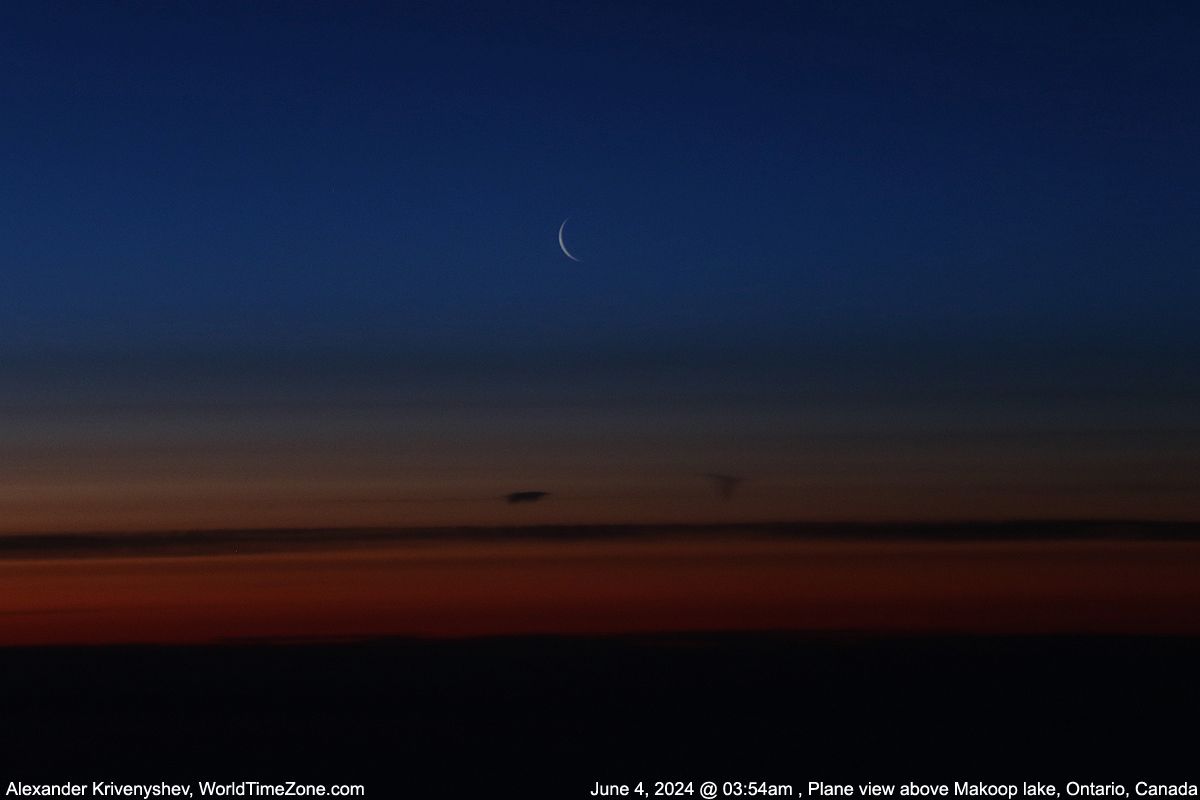 Community photo entitled Waning Crescent Moon (3.6%)  in a plane window above Makoop Lake, Ontario, Canada by Alexander Krivenyshev on 06/04/2024 at Makoop Lake, Ontario, Canada