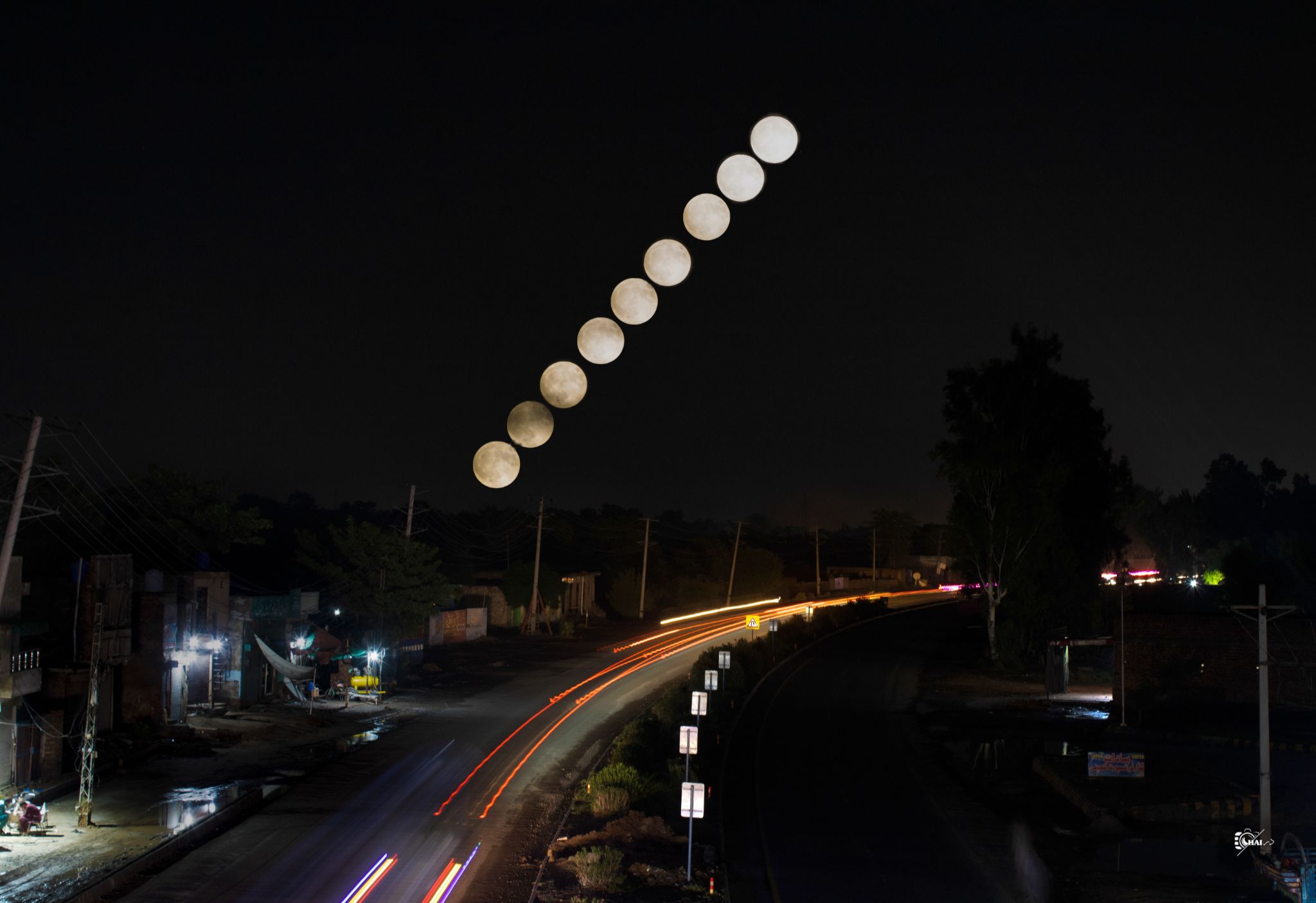 Community photo entitled Super Blue Moon Glow Over City Lights by Saqlain Haider on 08/19/2024 at Pattoki,Punjab,Pakistan