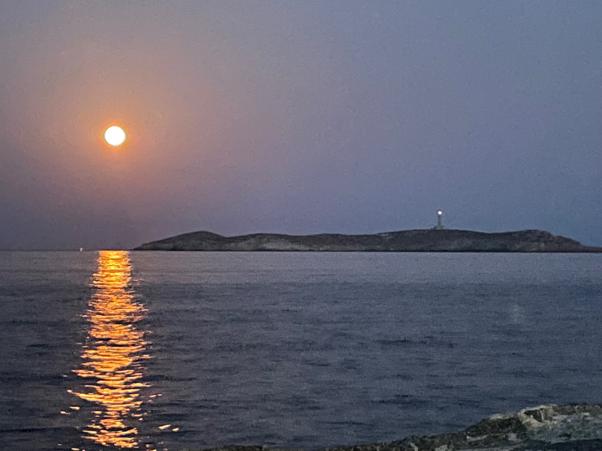 Community photo entitled Supermoon, over Hermoupolis Lighthouse. by Ioannis Kopelos on 08/19/2024 at Hermoupolis, South Aegean, Greece