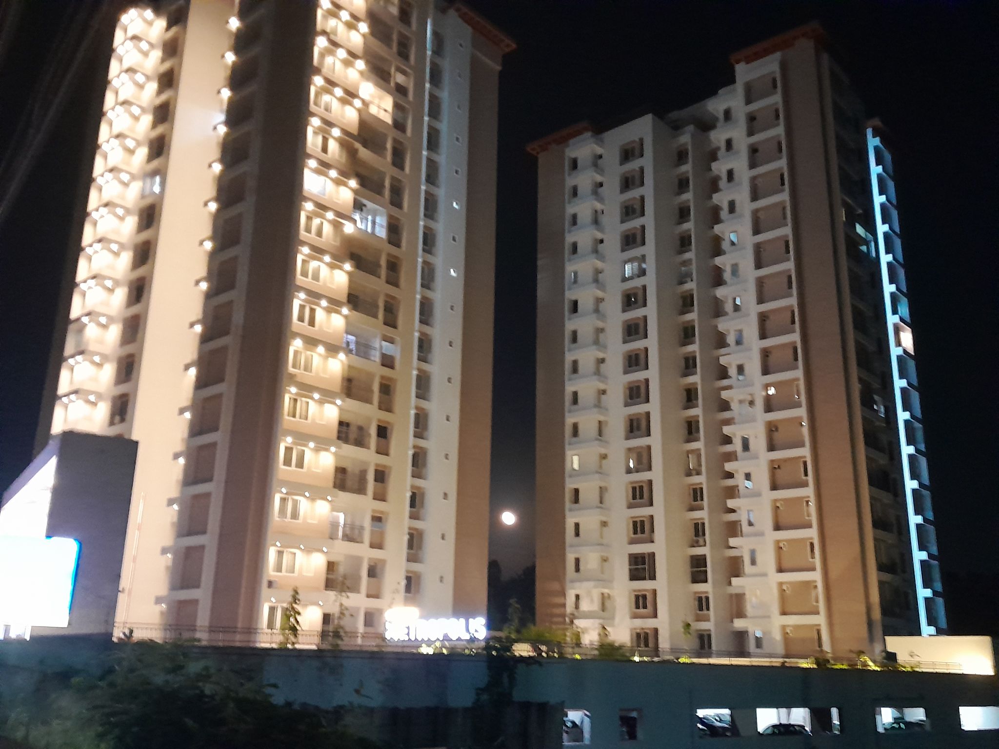 Community photo entitled Big Moon Sneaking Between the Buildings by Praveen Titus on 09/20/2024 at Trivandrum, Kerala, India