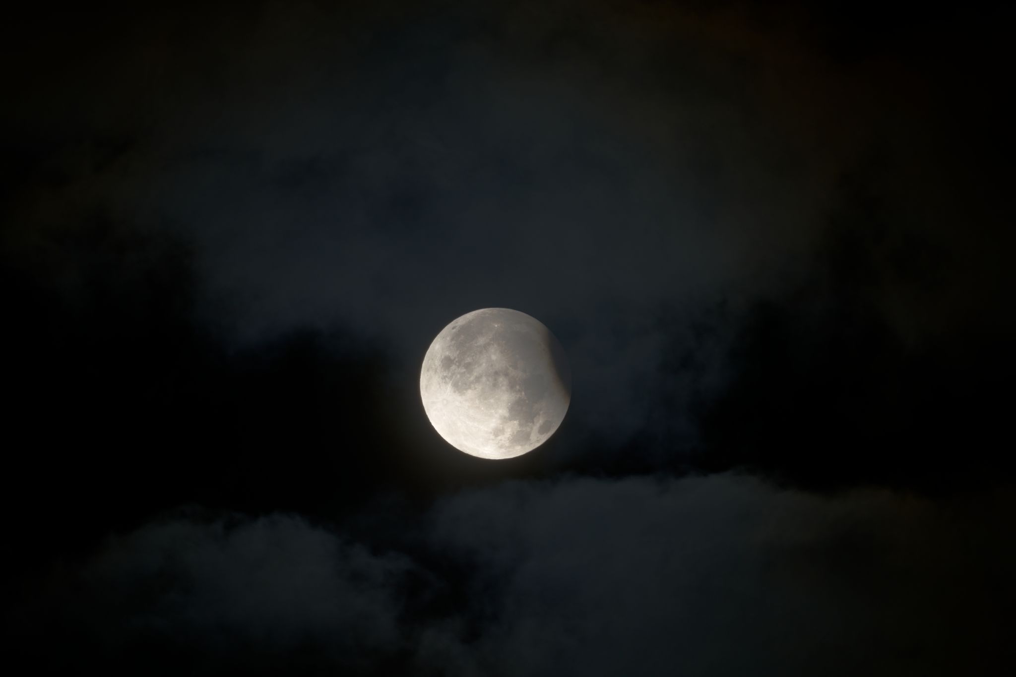 Community photo entitled Partial lunar eclipse among clouds by Fausto Lubatti on 09/18/2024 at Melegnano, Lombardy, Italy