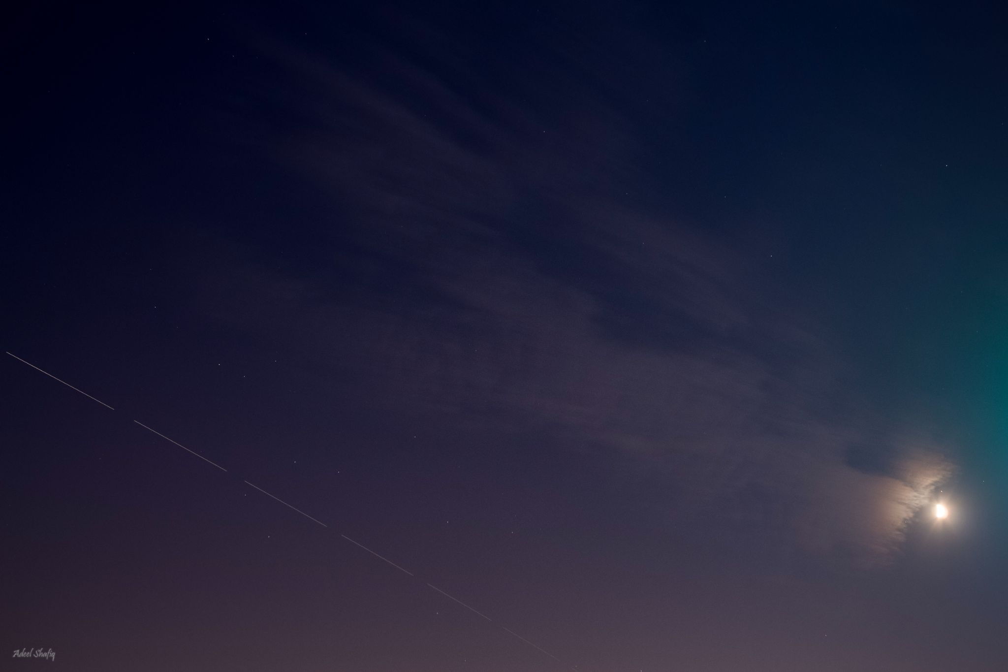 Community photo entitled ISS, Crescent Moon, Antares, cloud trails and Iridescence! by Adeel Shafiq on 09/10/2024 at Lahore, Punjab, Pakistan