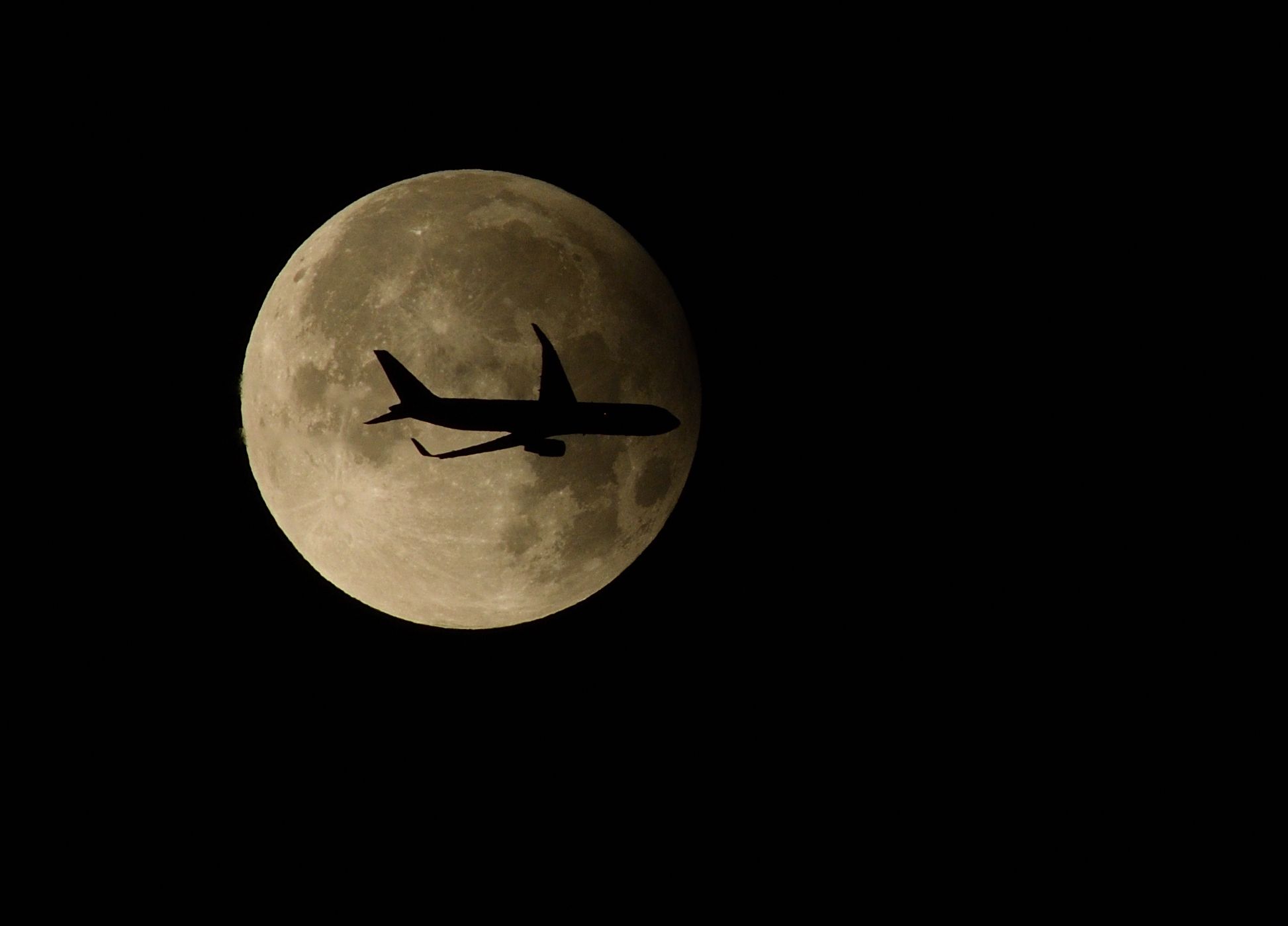 Community photo entitled Partial lunar eclipse with passing aircraft viewed from Dublin, Ireland. by Paul Osborne on 09/18/2024 at Blackrock, County Dublin, Ireland