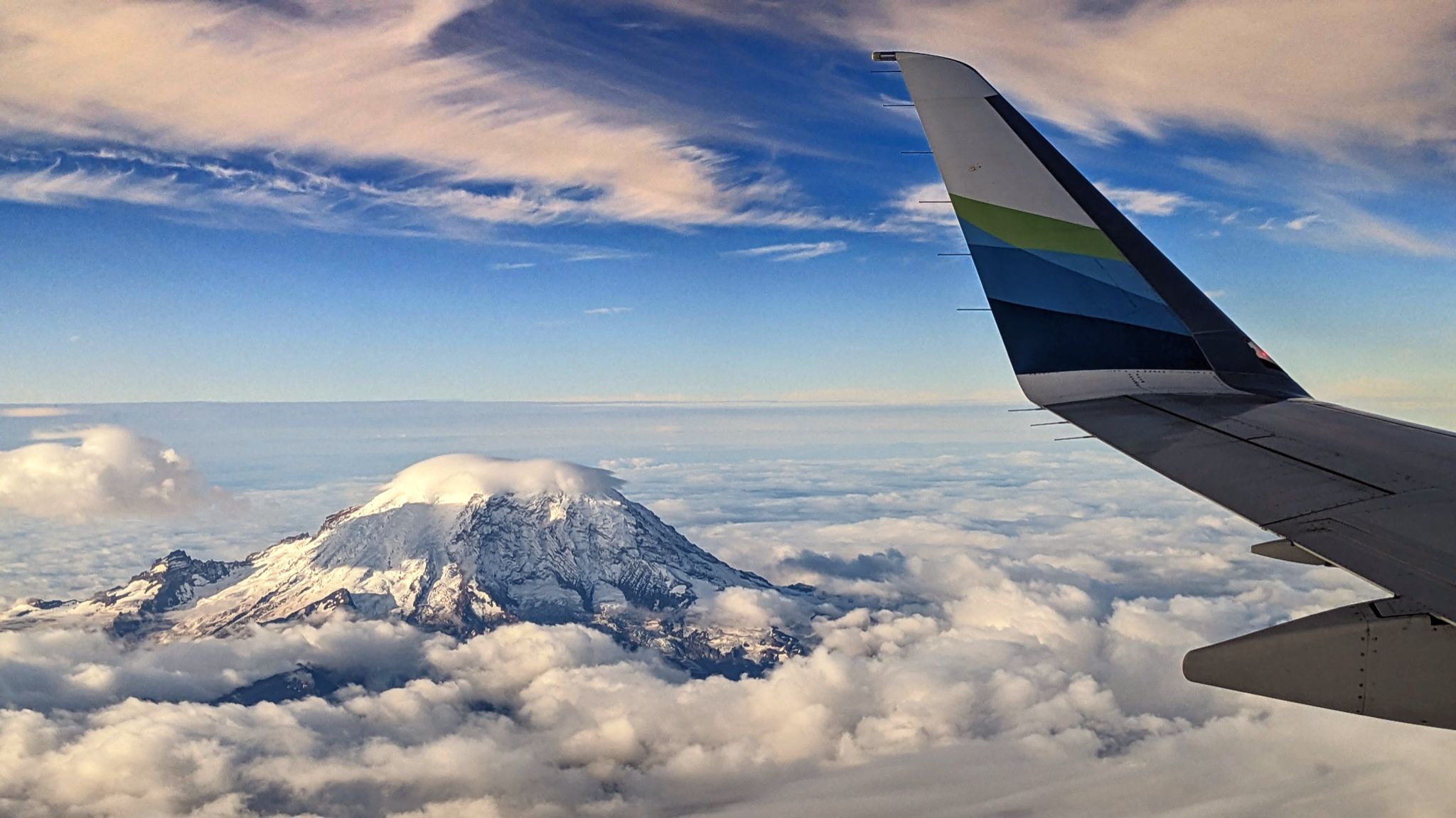 Community photo entitled Mt. Rainier, 14,411 feet summit,  above the clouds. by Steve Price on 09/14/2024 at Seattle  area from airplane window