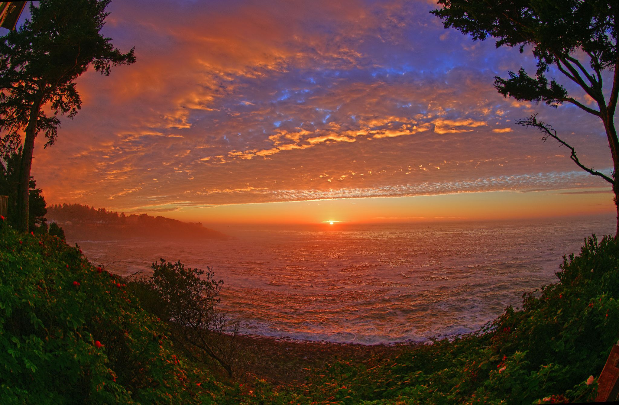 Community photo entitled Distant Pacific Sunset by Cecille Kennedy on 10/07/2024 at Depoe Bay, Oregon