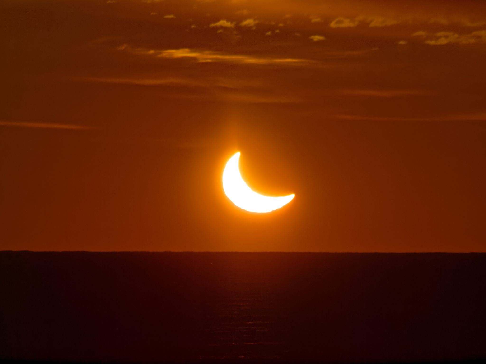Community photo entitled Partial solar eclipse at sunrise by Iaroslav Kourzenkov on 03/29/2025 at Halifax, Nova Scotia, Canada