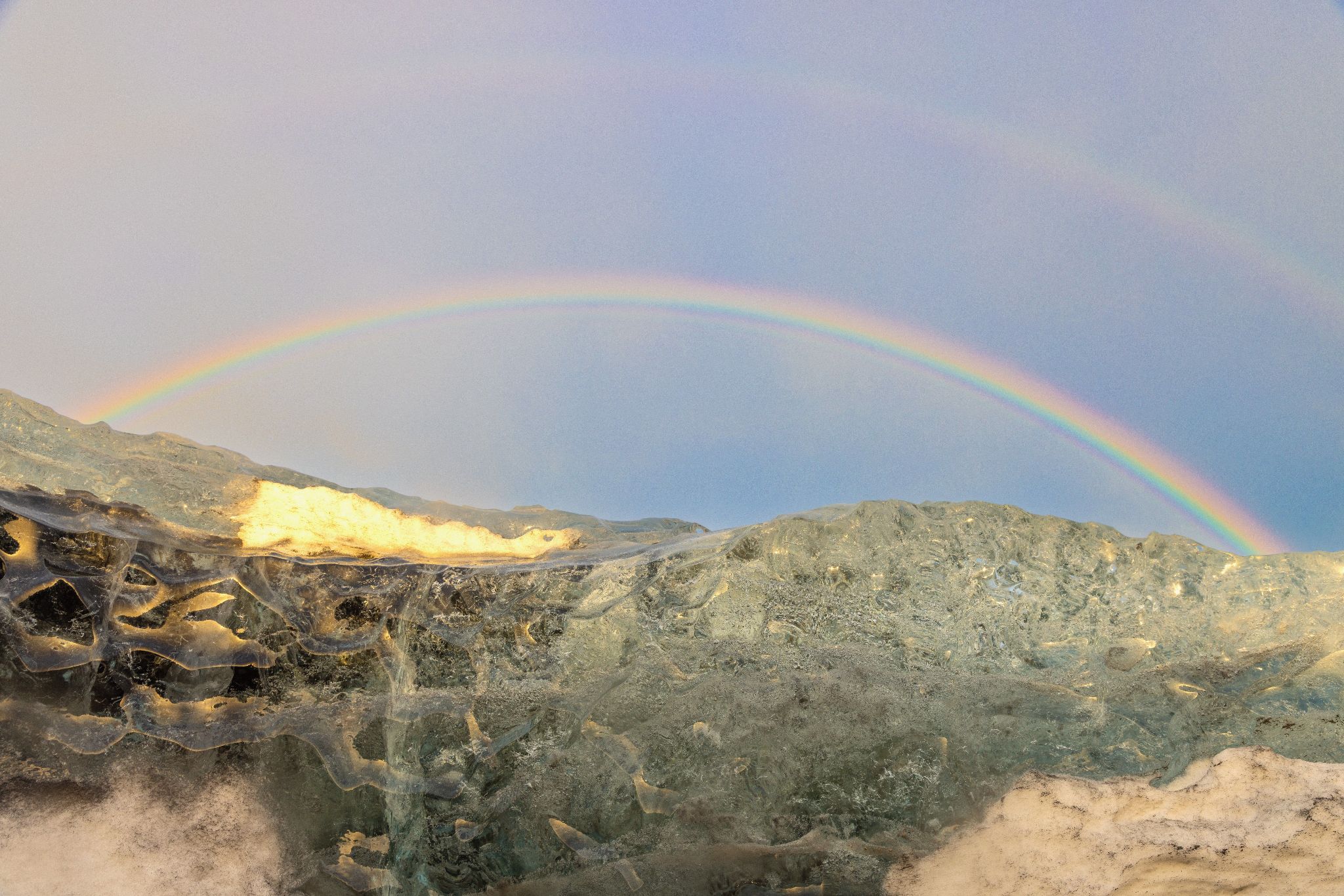 Community photo entitled Rainbow From Inside A Glacier by Maria Cruz on 01/19/2026 at Southeast Iceland